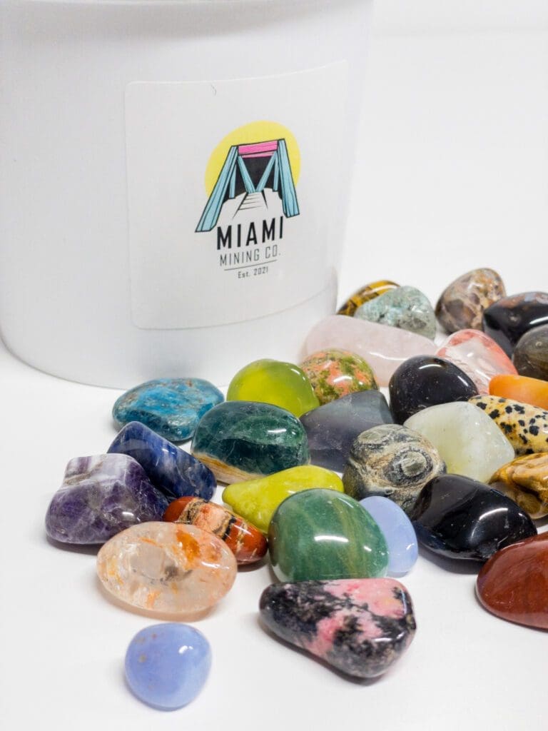 Buried Treasure Gallon Gemstone Mining Bucket - 14 Lbs With Tumbled Stones, Crackable Geode & Mining Kit